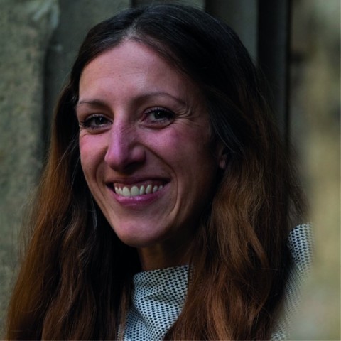 Simone Orgel with long hair smiling broadly