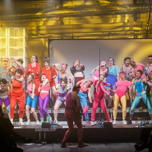 Heartchor singing in colourful aerobicswear